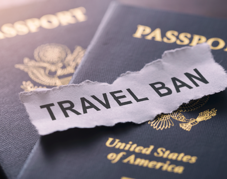 Passport with Travel Ban message on ripped paper